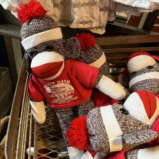 two sock monkeys in a basket