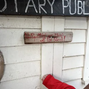 a child pointing at a sign