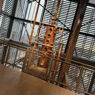 a copper still in the background