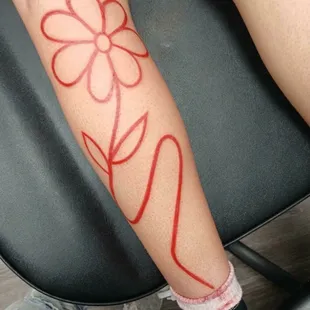 Giant simple red graphic flower tattoo by J.J.