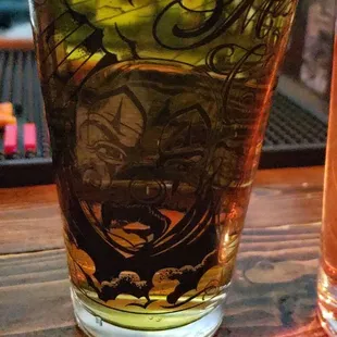 a glass of beer and a bottle of beer