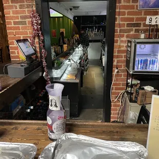 a view of a bar from the counter