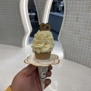 Vanilla soft serve in a waffle cone