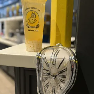 a cup of tea and a clock