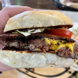 8-ounce prime brisket burger with cheddar and smoked, grilled bacon