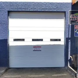 Another great Commercial Garage Door installation by RAC Doors Unlimited of El Paso, Texas @ University Auto Center in El Paso Texas.