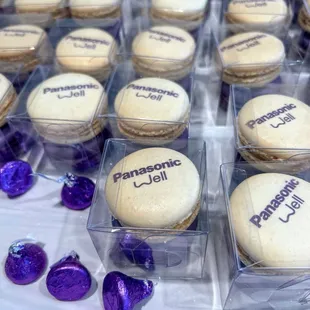 Corp logo macarons in French vanilla and raspberry flavors.