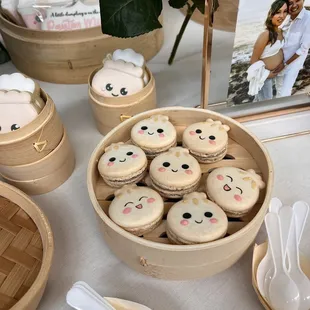 a basket of cookies with faces on them