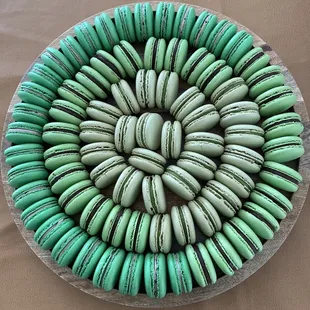 a plate of macarons on a table