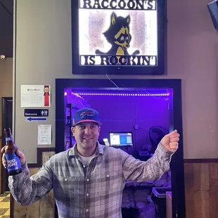 a man holding a beer