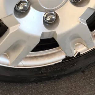 Cracked and broken hub cap.