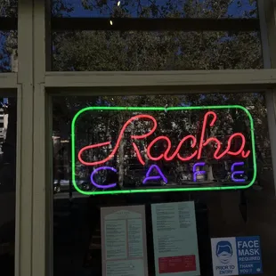 a neon sign in the window