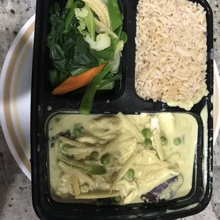 Green curry set on a dinner plate to show the quantity of food for $20. Don&apos;t order this! It&apos;s a trap to get you to spend more money.