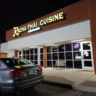 a car parked in front of a restaurant