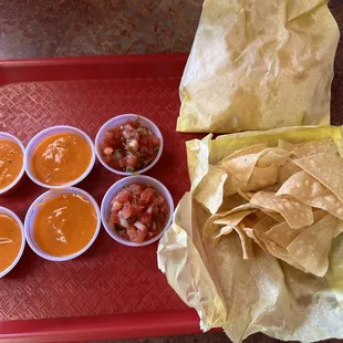 a tray of tortillas and salsa
