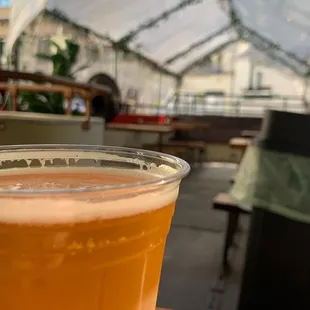 a glass of beer on a table