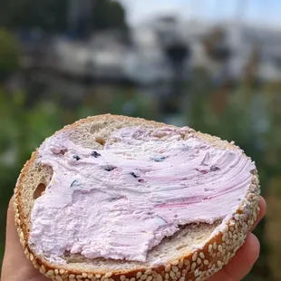 Sesame bagel with huckleberry cream cheese