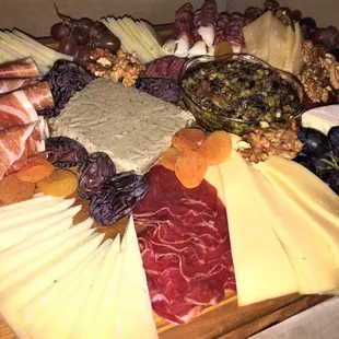 Cheese &amp; Charcuterie Board with several varieties of premium cheese, meats and accompaniments