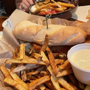 a plate of french fries and a sandwich