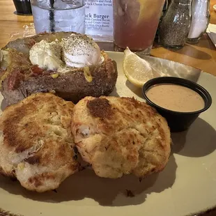 English cod cakes with a loaded baked potato.