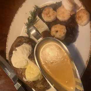 Sirloin steak with shrimp and baked potato