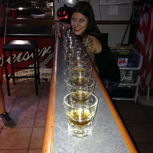 a woman sitting at a bar