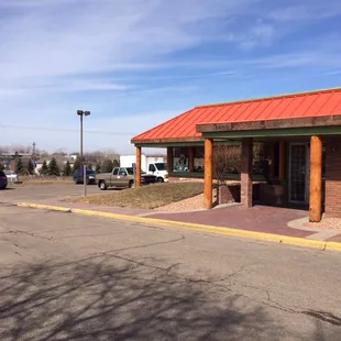 a brick building with a red roof