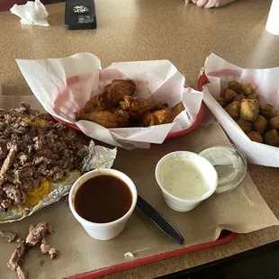 Chopped Beef baked potato, mango habanero wings, and fried okra