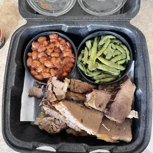 Beef brisket platter with green beans and baked beans