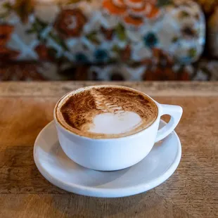 a cup of coffee on a saucer