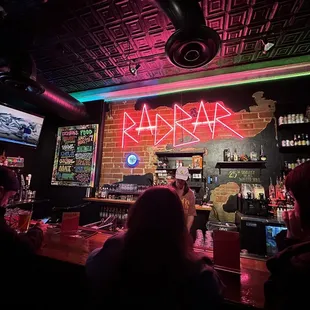 people sitting at the bar
