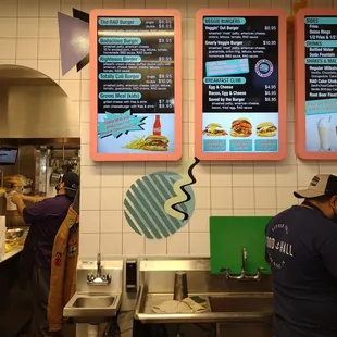 View of the menu boards and kitchen preparation area
