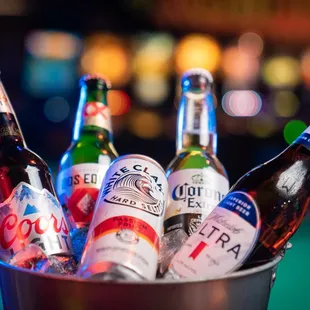 a bucket of beer bottles