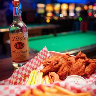 a tray of fried chicken and fries