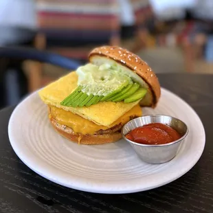 Breakfast Sandwich w/ just egg, american cheese, sesame bun, creamy herb aioli | $8 + $3 Beyond Breakfast Sausage + $2 avocado