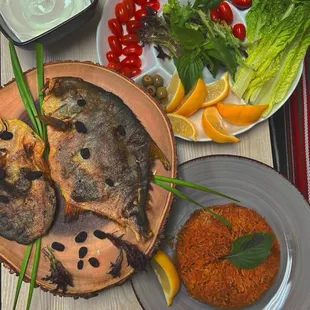 a plate of fish and vegetables