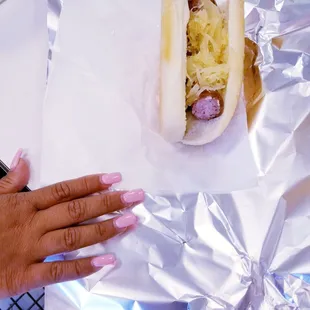 She bit the end off the sausage. Looks painful.