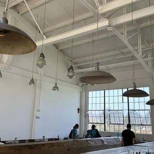 Vaulted ceiling with wall of windows overlooking at the bay