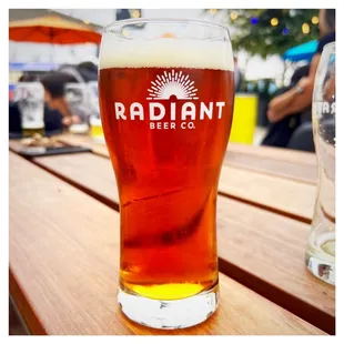 a glass of beer on a table