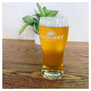 a glass of beer on a table