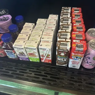 Kids and adult juice boxes and sodas, yogurt and quinoa salad.