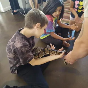 Birthday fun being ale to safely touch, hold and learn about snakes.