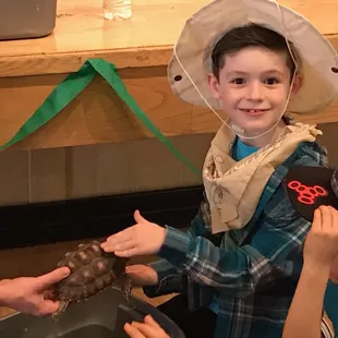 The birthday boy learns the difference between a turtle and a tortoise.