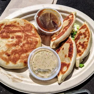 Pot stickers and Philly cheese steak with Mac n cheese and green Chile sauce