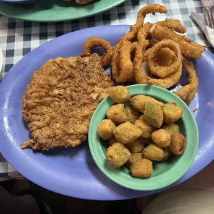 Chicken fried steak, fried okra and onion rings.