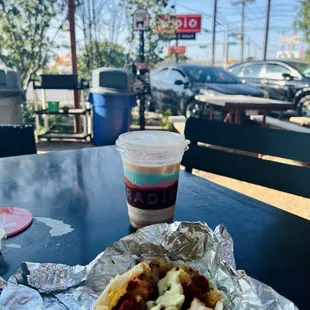 a hot dog and a drink on a table