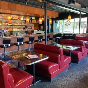 red booths and tables in a restaurant