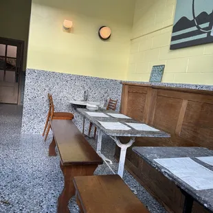 a restaurant with tables and benches