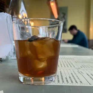 a glass of iced tea on a table