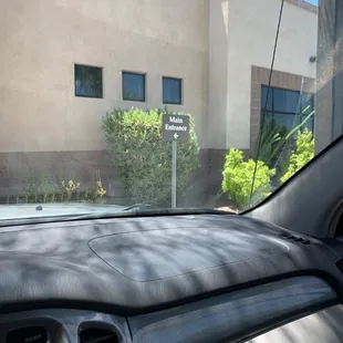 The entrance is opposite the street and parking lot.
